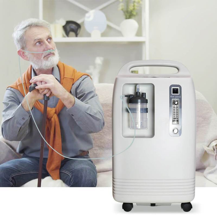 elderly man using an oxygen concentrator