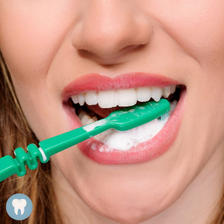 woman with white teeth brushing her teeth