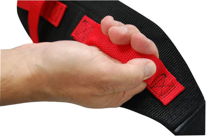 Hand holding a black and red strap with a visible brand logo.