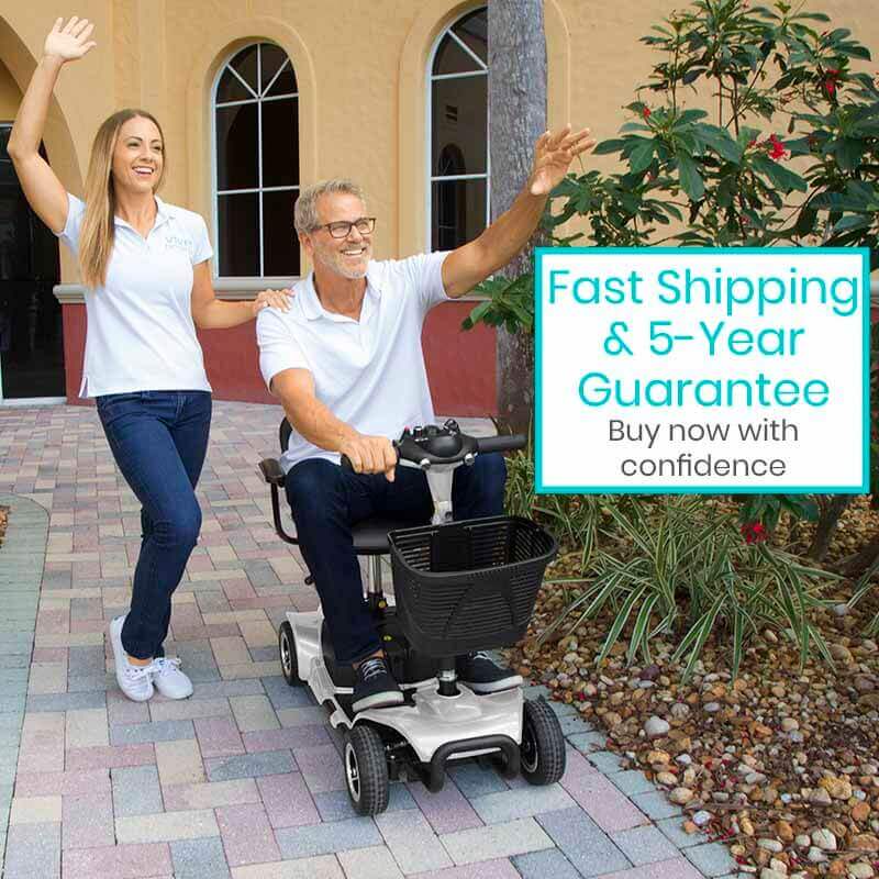 Man using a mobility scooter with a woman beside him, promoting fast shipping and a 5-year guarantee.