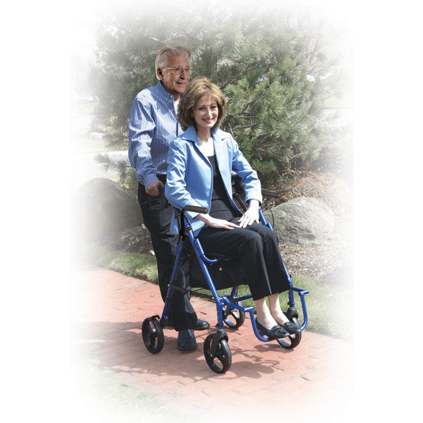 Woman using a blue rollator with a man standing behind her outdoors.