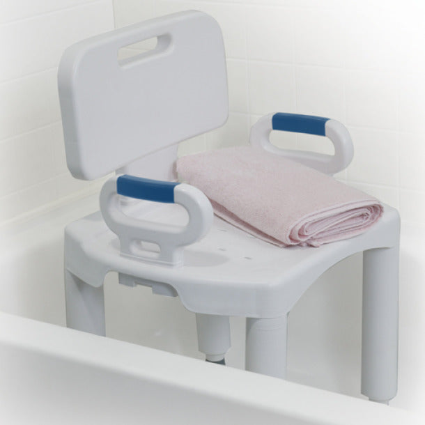 White bath seat with blue handles and a pink towel on a white background