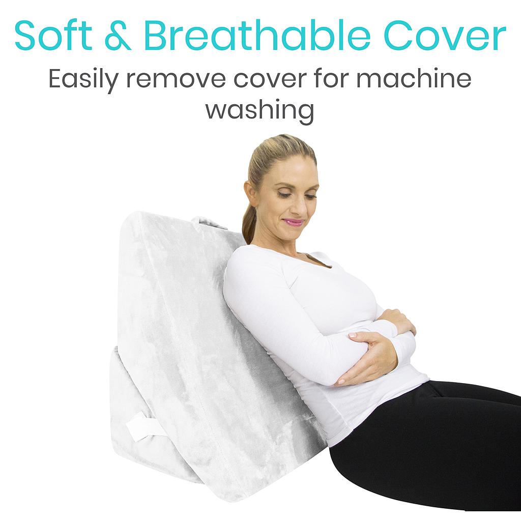 Woman using a white cover for machine washing with text highlighting its softness and ease of removal.