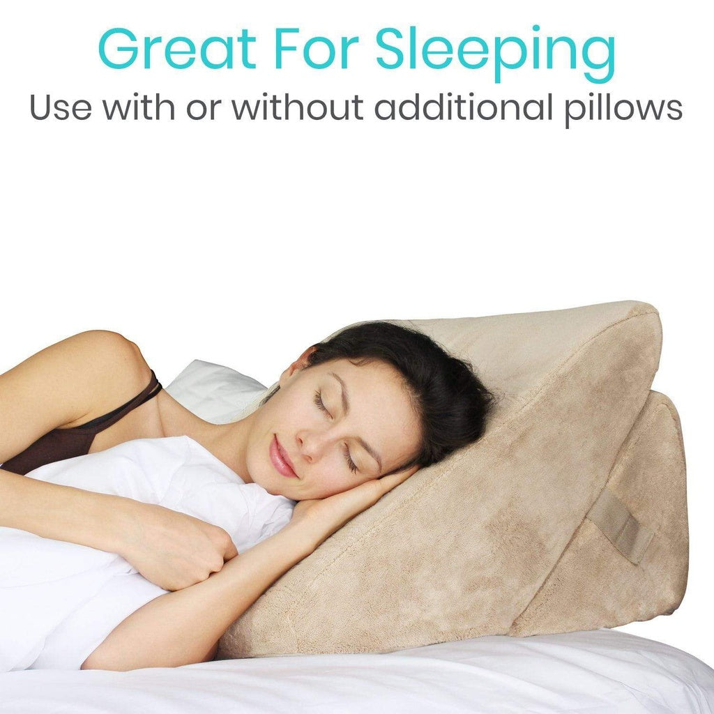 Woman sleeping with a beige wedge pillow on a white background