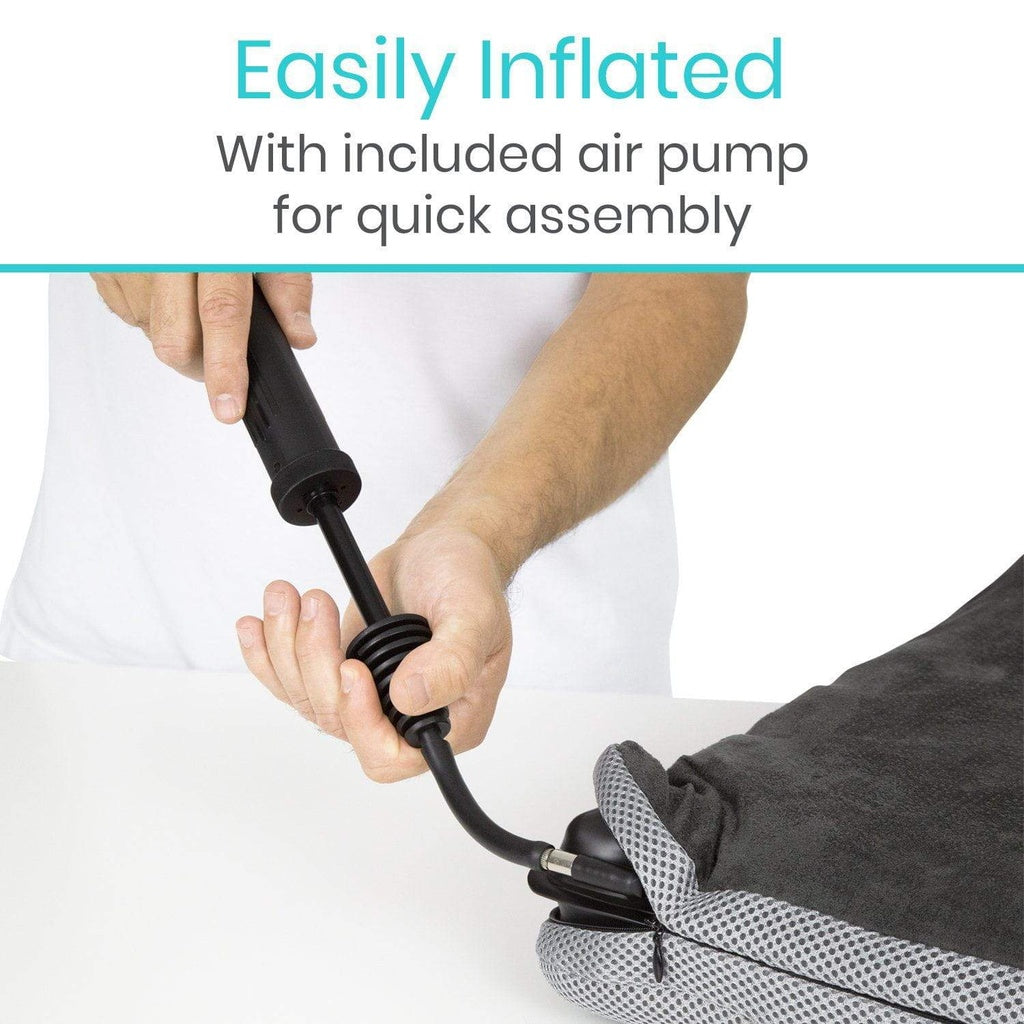 Hand using an air pump to inflate a black and gray bag with text 'Easily Inflated With included air pump for quick assembly' on a white background.