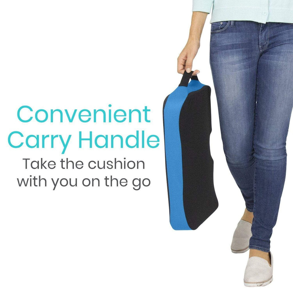 Person holding a blue and black cushion with text about a convenient carry handle.