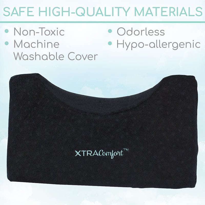 Black pillow cover with XTRAComfort branding on a light blue background, featuring safety and quality attributes.