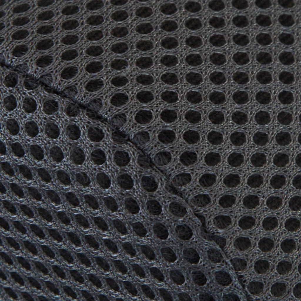 Close-up of a textured black fabric with a grid pattern