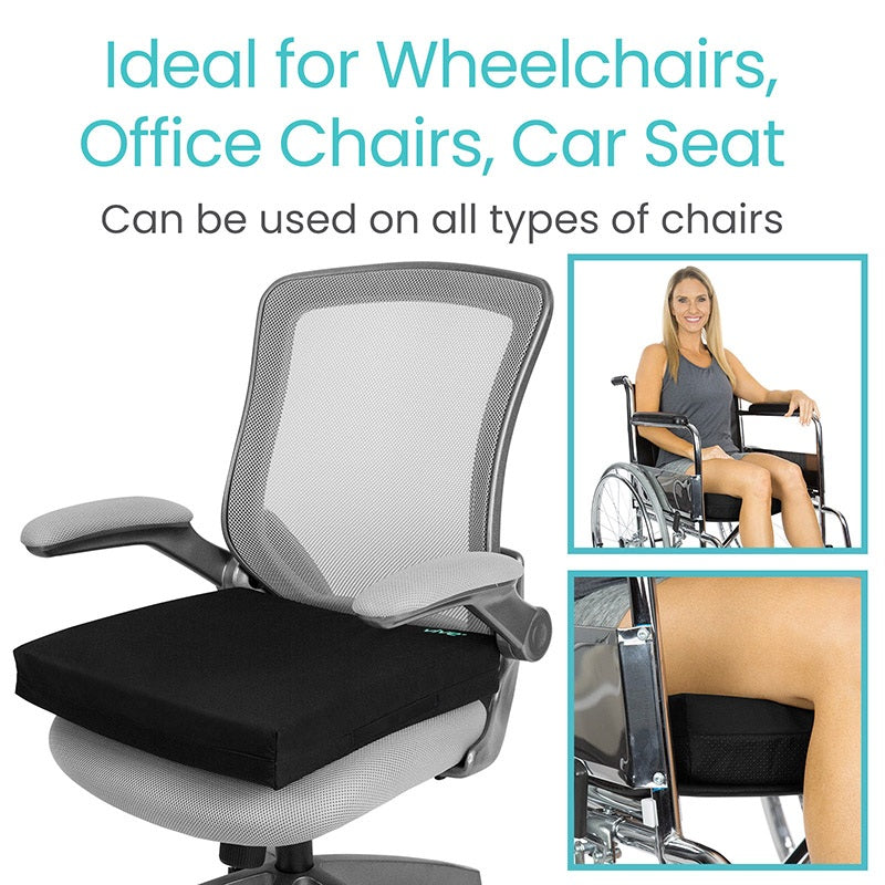 Black seat cushion on a chair with text indicating its use for wheelchairs, office chairs, and car seats.