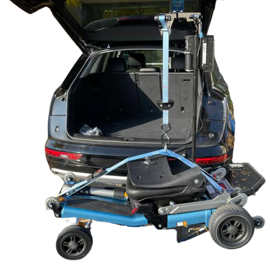 Blue and black vehicle ramp attached to a car with open trunk on a white background