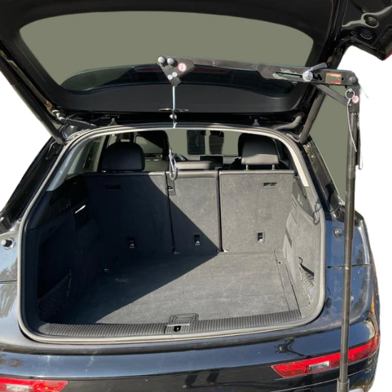Open trunk of a car with a roof rack on a white background