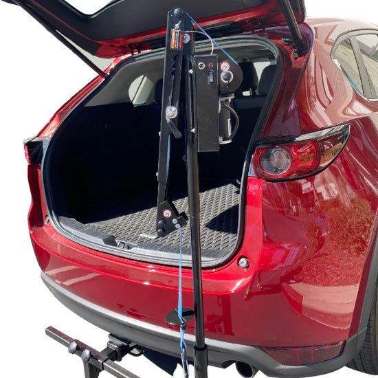 Red car with a bike rack attached to the back