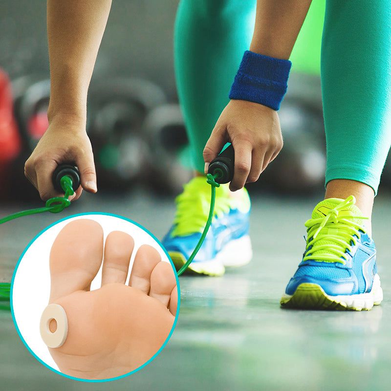 Person jumping rope with close-up of foot wearing a toe ring in a gym setting
