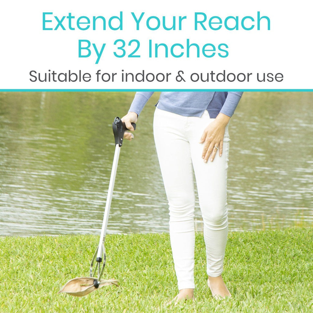 Person using a tool to extend reach by 32 inches, suitable for indoor and outdoor use.