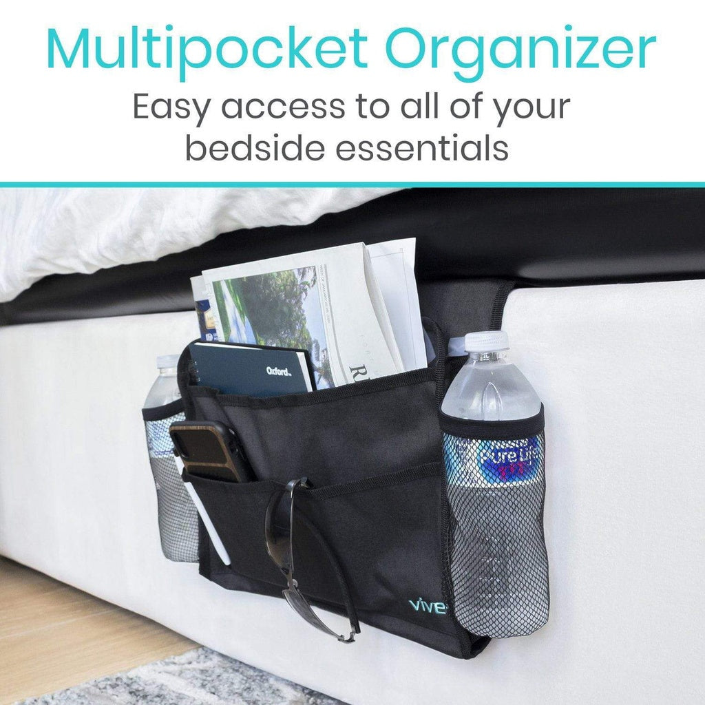 Black multipocket organizer with various items on a bed, labeled 'Vive'.