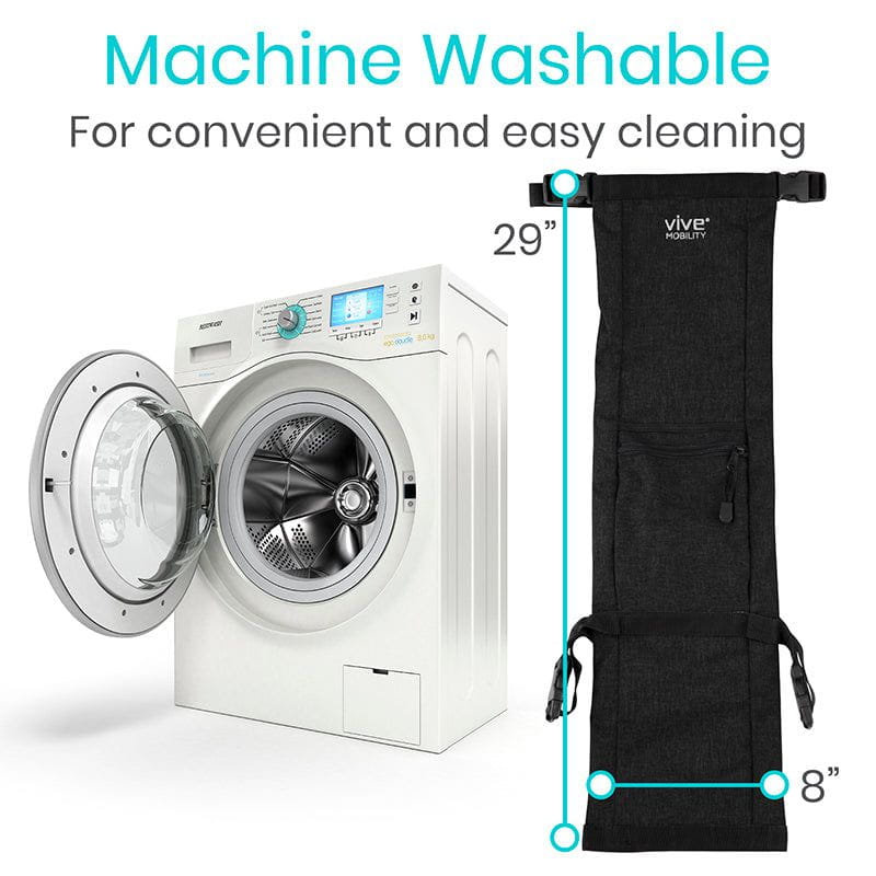 Black garment bag next to a washing machine with text indicating it is machine washable.