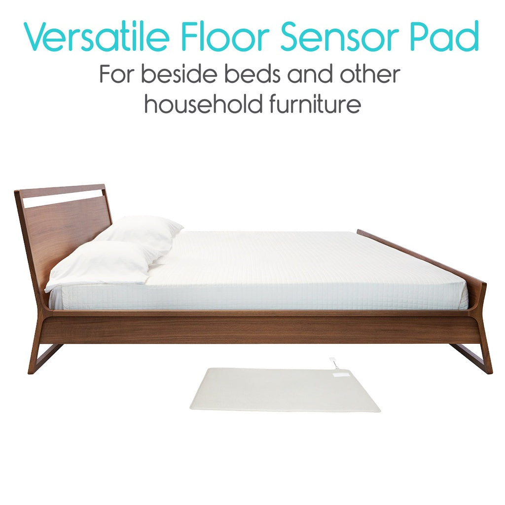 Bed with a white floor sensor pad beside it on a white background