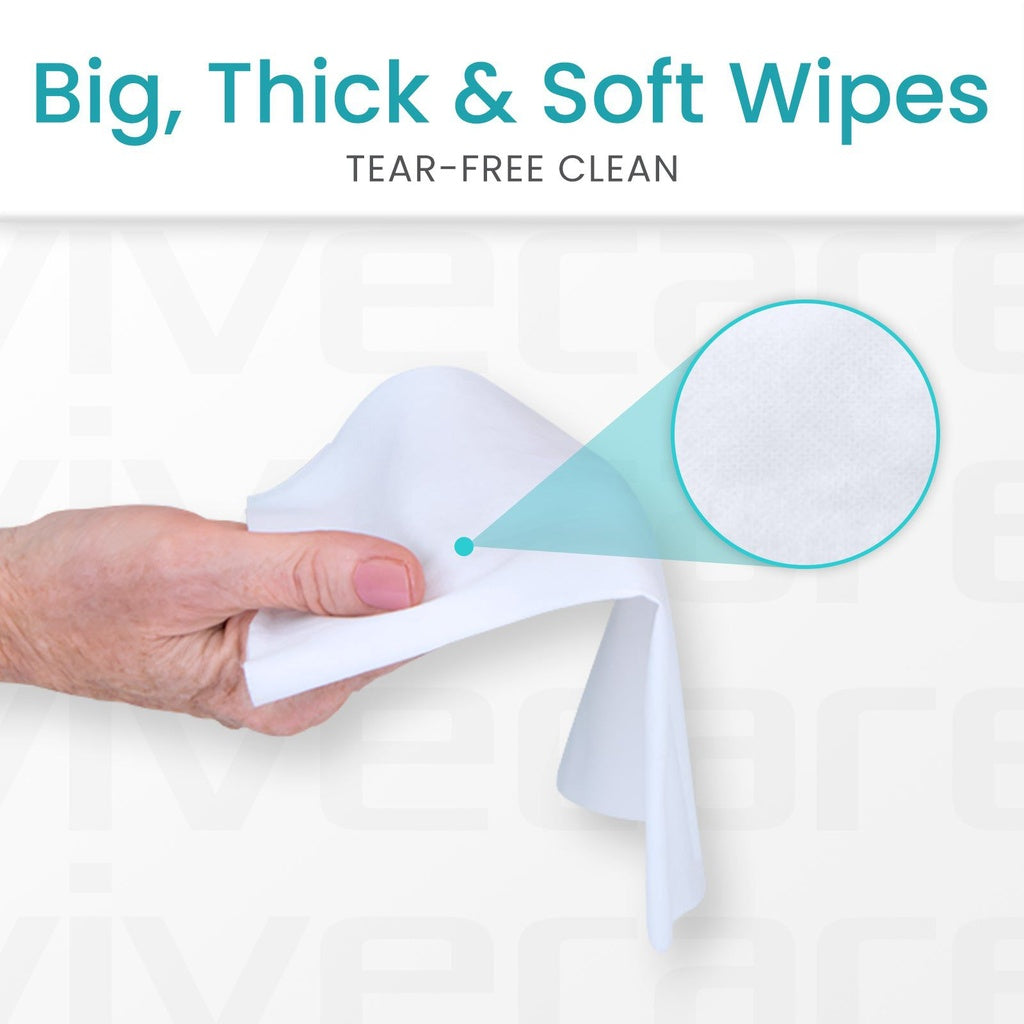 Hand holding a large, soft wipe with text 'Big, Thick & Soft Wipes' and 'Tear-Free Clean' on a white background.