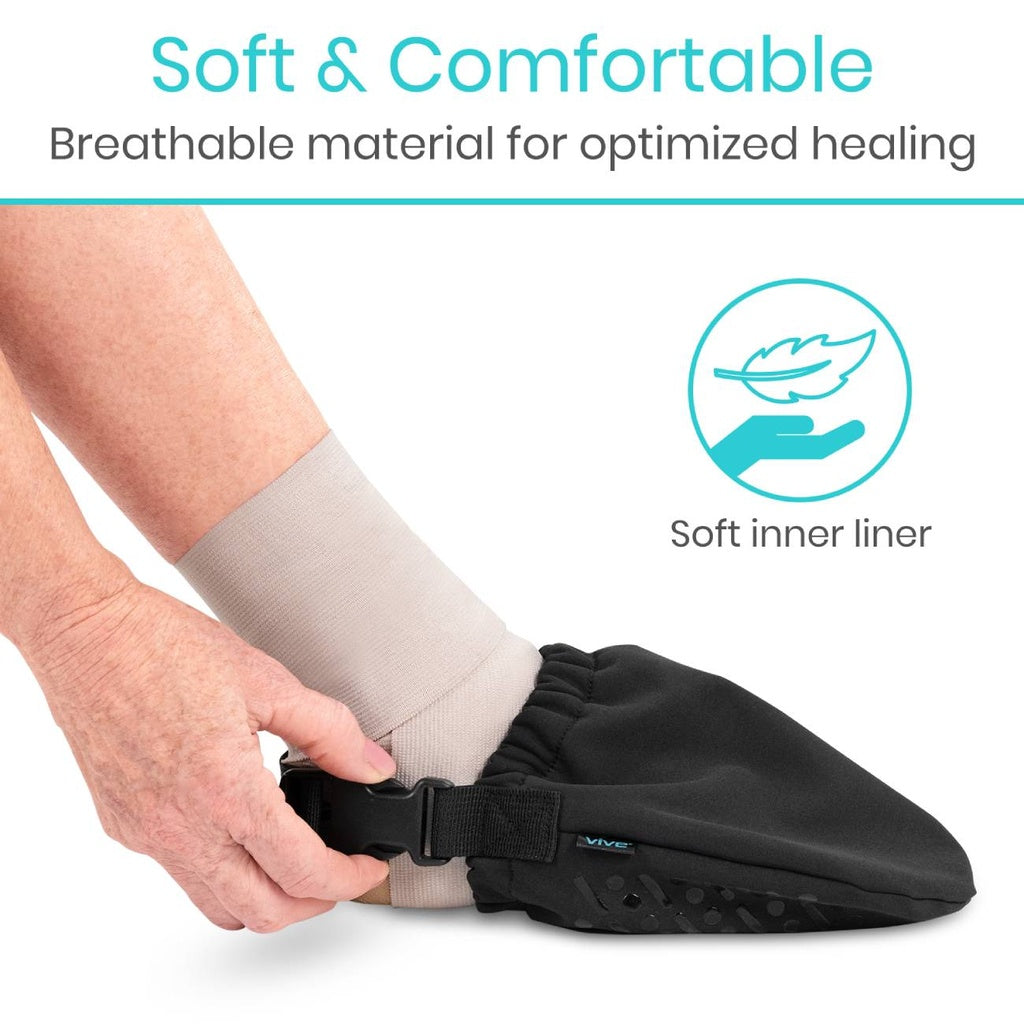 Black foot cover with a soft inner liner being worn, emphasizing comfort and healing.