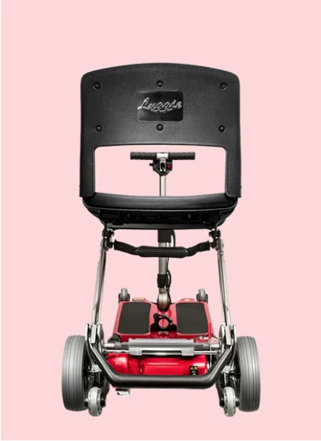 Red and black scooter with 'Luggie' branding on a pink background