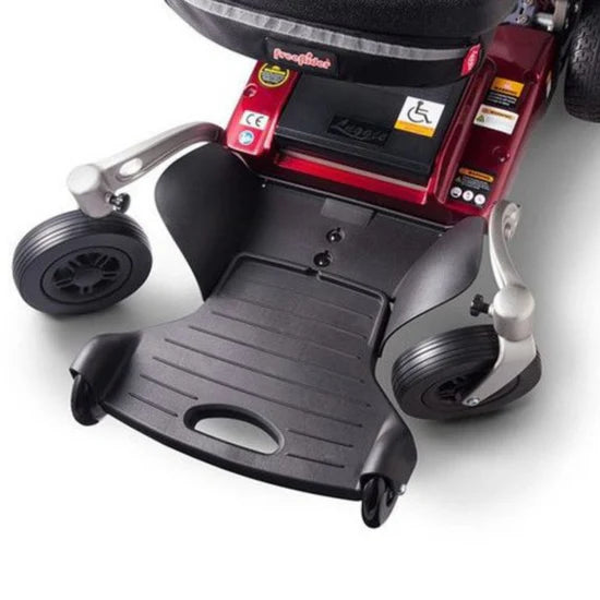 Close-up of a mobility scooter with visible branding on a white background