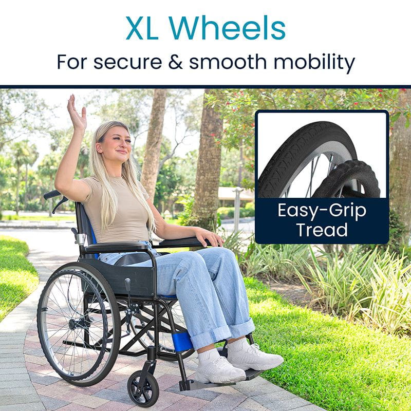 Person using a wheelchair with XL wheels in an outdoor setting, highlighting the ease of use.