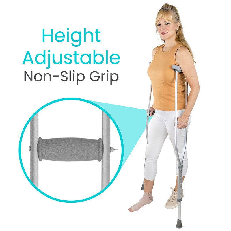 Woman using height-adjustable crutches with non-slip grip feature on a white background