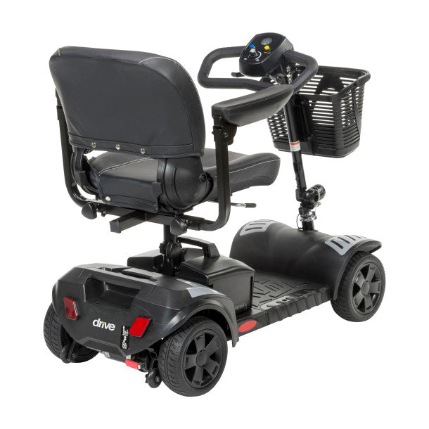 Black mobility scooter with a basket on a white background
