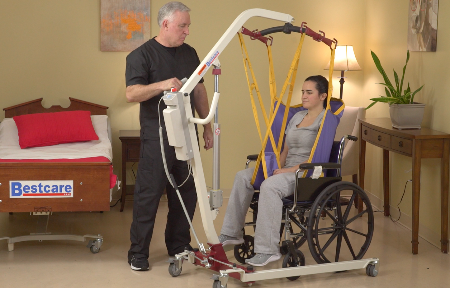 PL182 Patient Lift being used by caregiver transferring patient out of a wheelchair