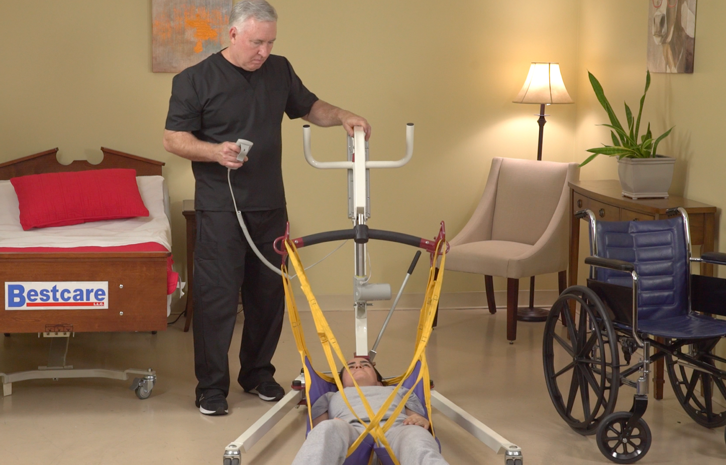 PL182 Patient Lift being used by caregiver picking up client off the floor.