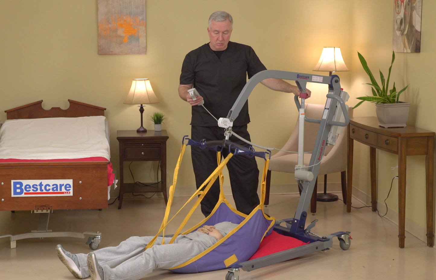 PL400 Patient Lift being used to lift patient off of the floor