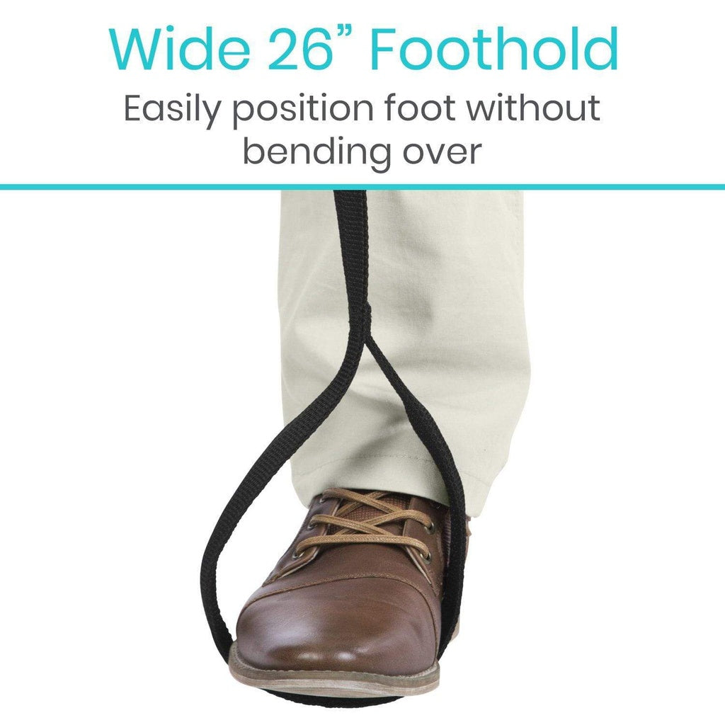 Brown shoe with a wide black strap labeled 'Wide 26” Foothold' on a white background