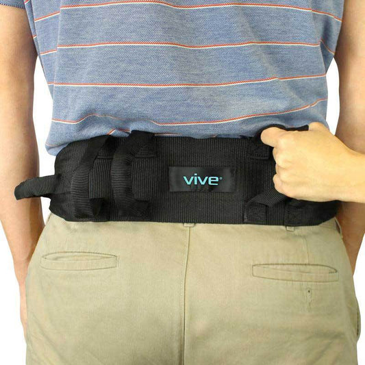 Person wearing a black waist trainer with 'vive' branding on a white background