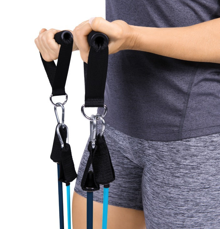 Person using resistance bands for exercise on a white background
