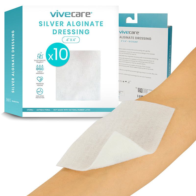 Vivicare silver alginate dressing packaging with a dressing applied to a person's arm.