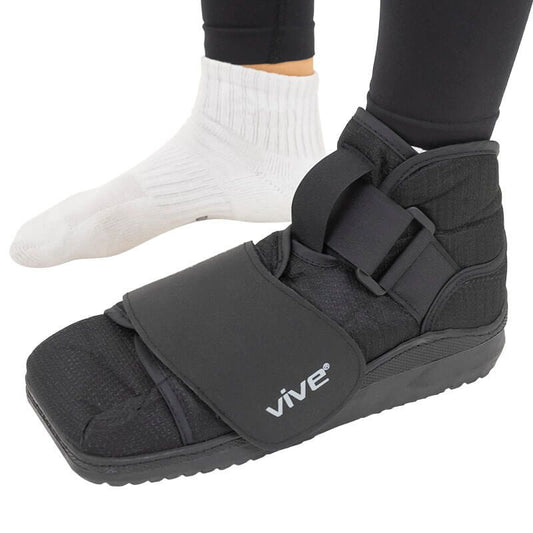 Black foot cast with straps on a white background