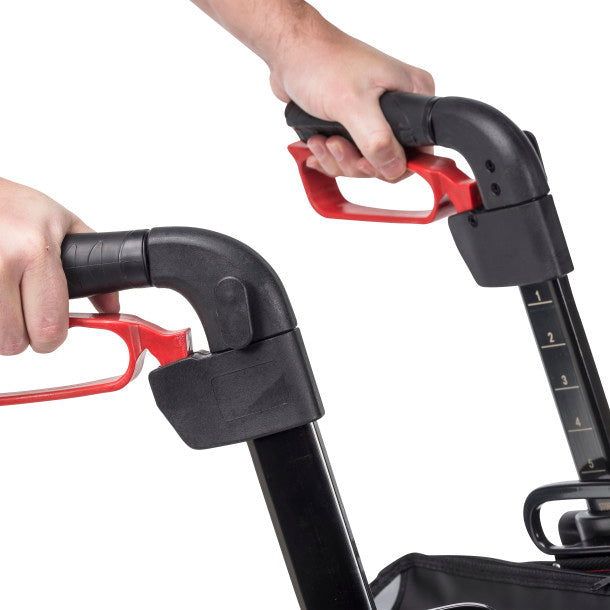 Close-up of a person holding a black and red scooter handle against a white background