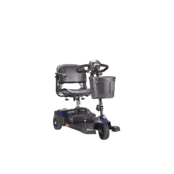 Three-wheeled mobility scooter with a basket on a white background