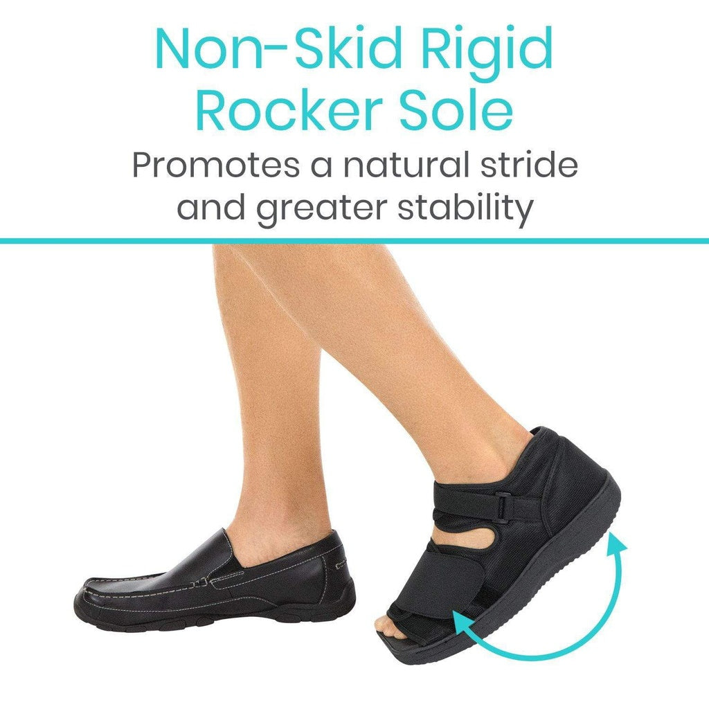 Black shoe with a non-skid rigid rocker sole on a white background