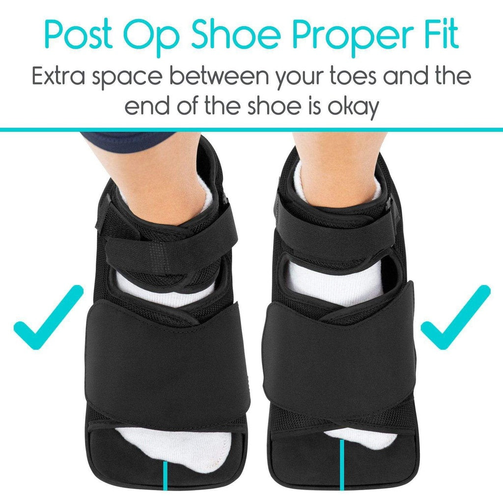 Black post-operative shoe with extra space between toes and shoe end, on a white background.
