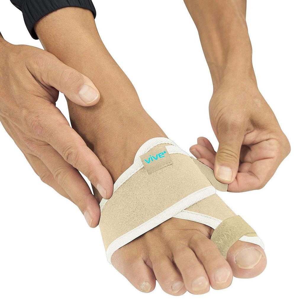 Person wearing a beige bunion corrector with 'Vive' branding on a white background