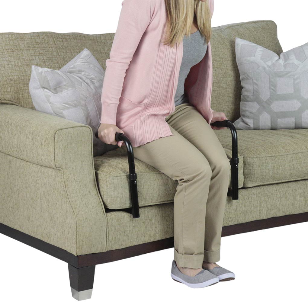 Person using a sofa lifter to get onto a couch