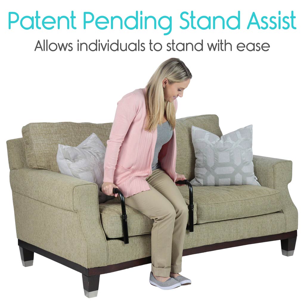 Woman using a 'Patent Pending Stand Assist' device on a couch with text indicating it helps individuals stand.