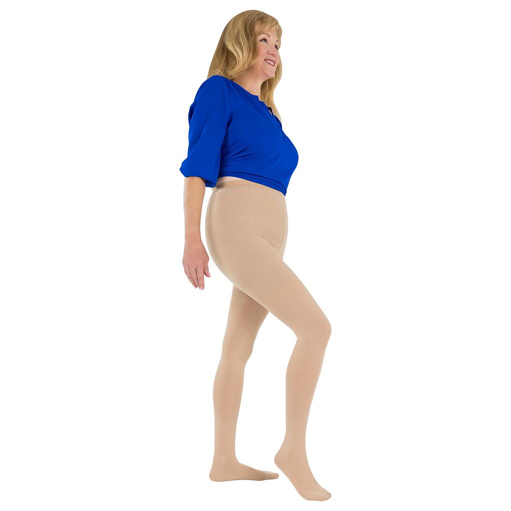Woman wearing beige tights and a blue top on a white background