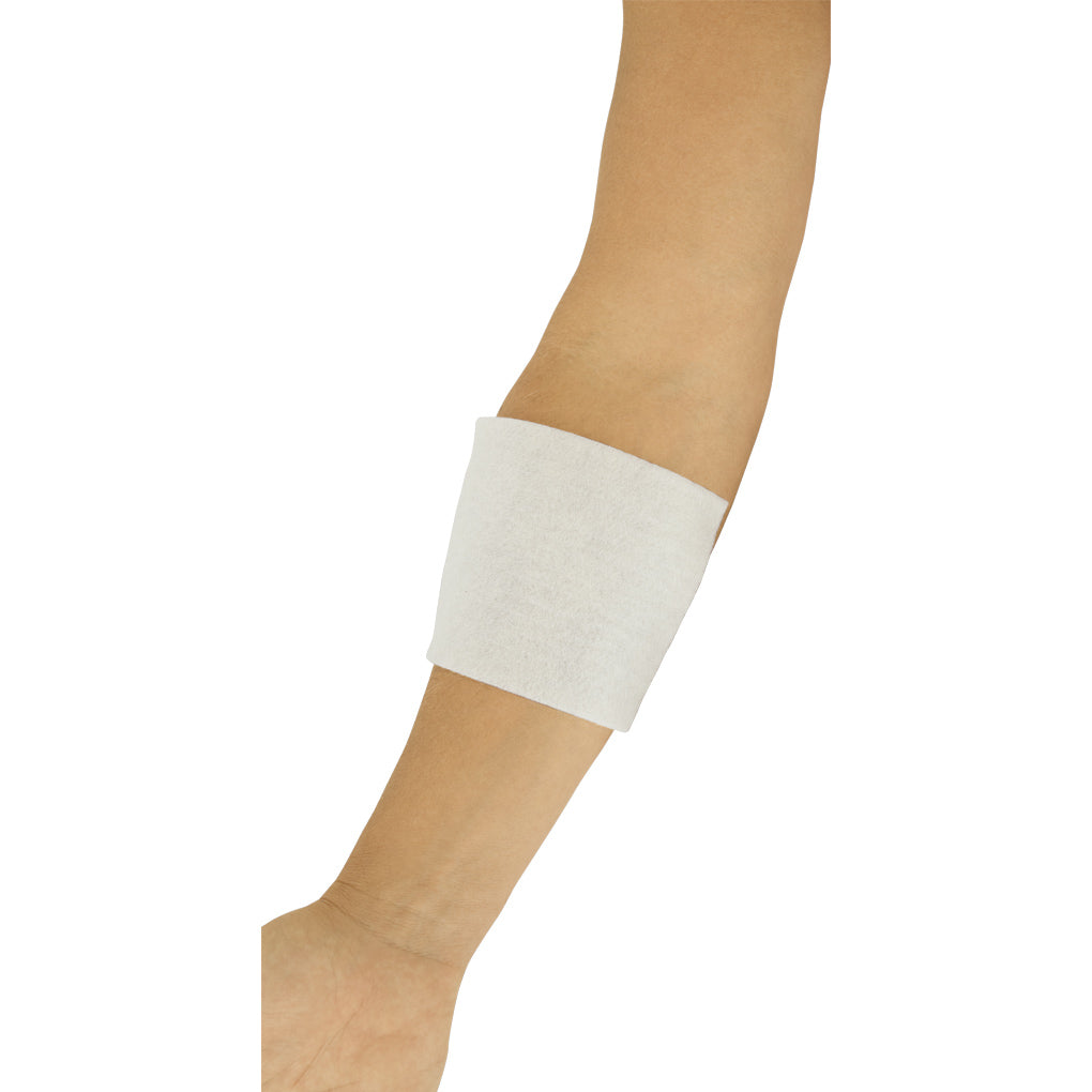 White bandage on a person's ankle against a white background