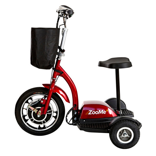 Red three-wheeled mobility scooter with a seat and black bag on a white background