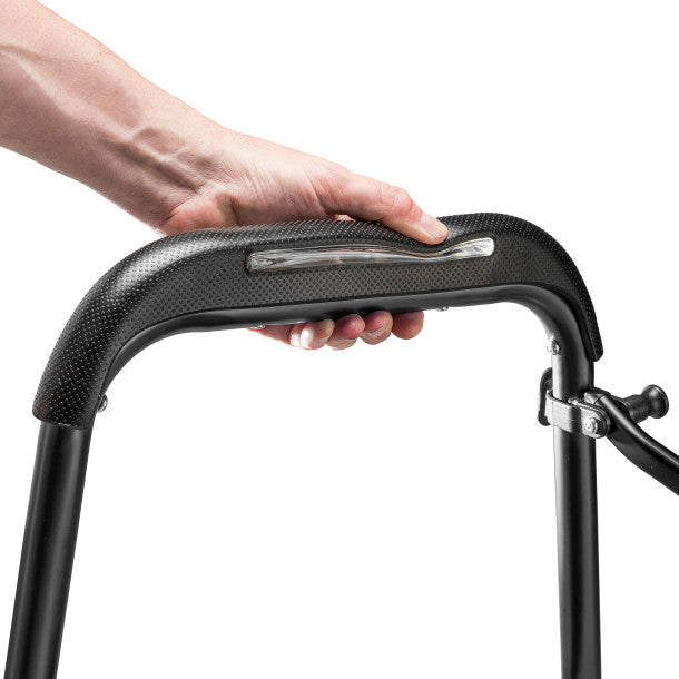 Hand holding a black handlebar with a white background