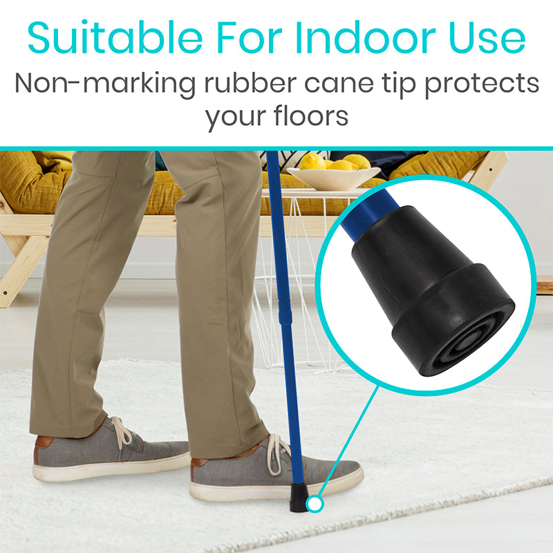 Person using a cane with a non-marking rubber tip on a light-colored floor.