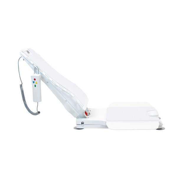 White medical examination table with armrest on a white background
