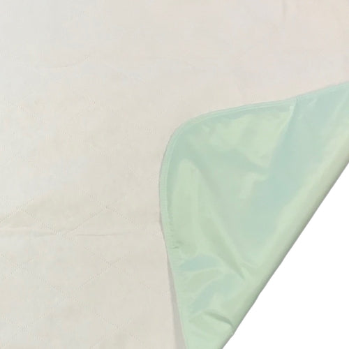 Light green fabric on a beige background